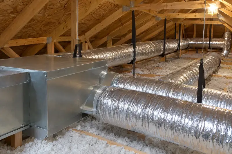 Insulated flexible ducts and a sheet-metal plenum running through an attic