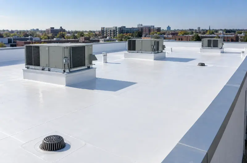 Low-slope commercial roof with a white TPO membrane and rooftop units